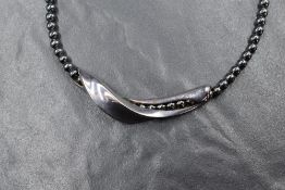 A Georg Jensen silver and hematite beaded necklace, the hematite beads having an organic silver