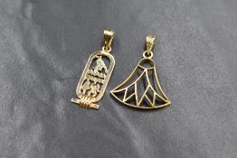 Two Egyptian 18ct gold pendants, one in the form of a traditional Egyptian lotus and the other a