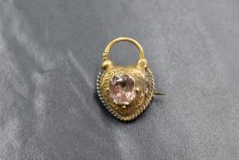 A yellow metal heart shaped brooch remodelled from a padlock style locket clasp, the engraved brooch