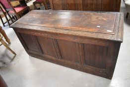 An 18th century oak four-panel coffer, the rectangular top with incised edge detail and