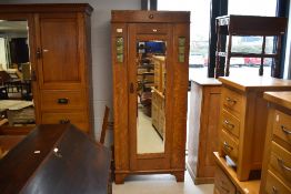 An early 20th century Arts & Crafts oak single wardrobe, in the manner of Shapland & Petter,