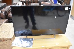 A JVC LT-42C550 42' LED full HD television, with power cable and remote control