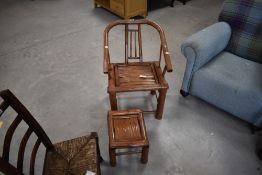 A Chinese bamboo armchair, having a tub style bent back and arms, sold with footstool, seat height