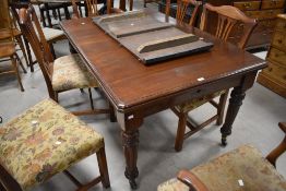 A late Victorian mahogany extending dining table, of rectangular form with moulded edge detail and