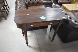 A 19th century mahogany side table, the rectangular top with rounded front corners raised on