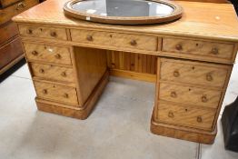 A Victorian satinwood pedestal kneehole desk, the rectangular top with shallow raised back , rounded