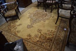 A large Belgian machine loomed Kandahar design room carpet, in mustards and browns with fringed ends