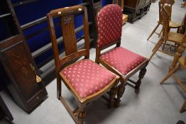 A harlequin set of six early 20th Century oak dining chairs