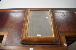A 19th century cushion moulded walnut and gilt wall mirror, of rectangular form 51cm x 38cm