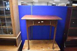 An early 20th century mahogany side table, the shaped rectangular top with moulded edge detail