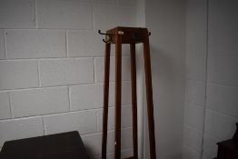 |a 20th century stained mahogany hall stand, of spreading square section form with four hooks to the