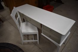 A 20th century white and grey painted dressing table, with an arrangement of five drawers, each with