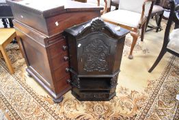 A small decorative carved and stained pine corner cupboard, in the Victorian style with arched