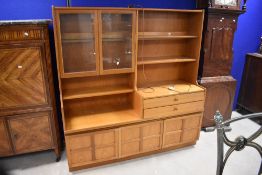 A 'Mid-Century' most likely 1970's Nathan teak room unit, with an arrangement of glazed doors,