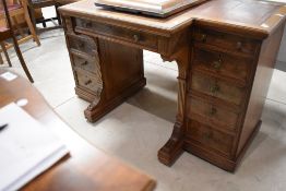 An attractive 19th century Gillows of Lancaster figured walnut break-front writing desk, the