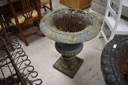 A green-painted cast-iron Campana style garden urn, of typical form with everted egg-and-dart rim