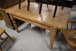 A modern pine farmhouse kitchen table, of 19th century design having a rectangular top with
