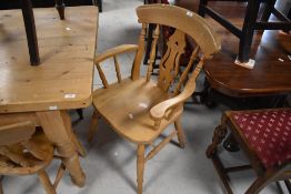 A Group of three modern beech farmhouse kitchen chairs (two singles and one armchair) of traditional