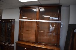 A Victorian mahogany full height bookcase having glazed section over double cupboard, dimensions