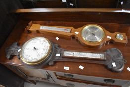 A late Victorian carved mahogany aneroid wheel barometer, of traditional design 85cm sold along with
