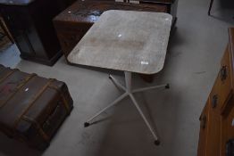 A vintage metal based pedestal table, in the manner of Herman Miller Eames with rounded