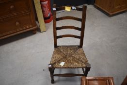 A small/child's rush seated latter back chair, in the 19th century style, seat height 30cm, 76cm