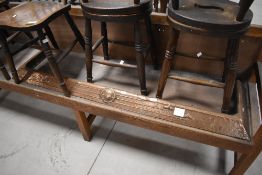 A late 19th century Art Nouveau copper mounted fire fender, decorated with a central circular device