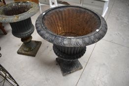 A larger black-painted cast-iron Campana style garden urn, of typical form with everted egg-and-dart