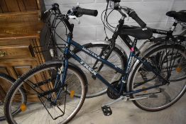 A Trek multi track 700 Sport road bicycle, twist grip gears and pannier bag mounts