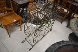 An attractive Regency design wire-work garden planter, the lift-off top planter with scrolled/