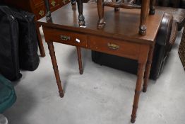 An early 20th century mahogany two drawer side table, with turned tapering supports 76cm x 76xm x