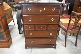 A Stag Minstrel chest of drawers, the moulded rectangular top above a 2/3/2 arrangement of drawers