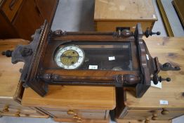 A 20th century mahogany Vienna style wall clock, with typical turned finials and pendants, the