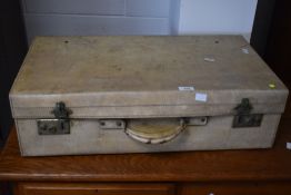 A vintage stitched vellum suitcase, of traditional design, stencilled initials E.M.T to each side,