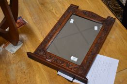 Local interest* Ernest John Oldcorn, an attractive Arts & Crafts oak wall mirror, of shaped