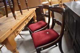 A pair of 19th Century mahogany rail back dining chairs
