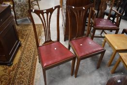 A set of six Edwardian design mahogany dining chairs (four single and two carver armchairs) each