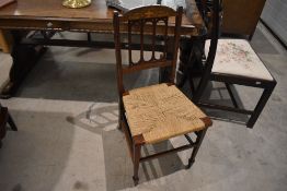 An attractive Edwardian inlaid mahogany string seated bedroom chair, the shaped toprail inlaid