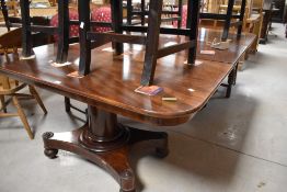 A 19th century mahogany twin-pedestal dining table, the rectangular ends with rounded front