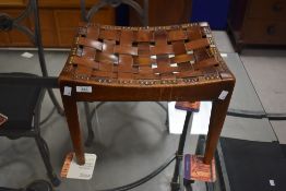 Local interest* an Arts & Crafts oak and leather stool most likely from workshop of Arthur W Simpso