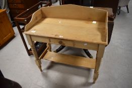 A reclaimed pine washstand, of traditional form with three quarter gallery over a short frieze