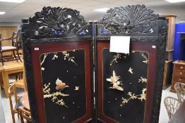 A late 19th century Japanese Shibayama inlaid two-fold room screen, having carved and pierced bird