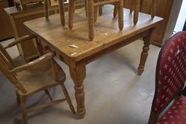 A 20th century pine farmhouse kitchen table, the rectangular top with rounded corners over a