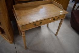 A late 19th/early 20th century pine wash stand, the rectangular top with shallow three-quarter