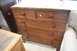 A 19th century oak chest of drawers, the moulded rectangular top above two short and three long