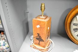 A late 20th-century wooden table lamp, featuring a selection of pyrogravure ballerina silhouettes,