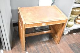 Thought to be early 20th-century Art Deco-style walnut piano stool, having a leather padded seat,