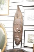 A small selection of presumed 20th-century African Tribal Art, to feature a large dark hardwood