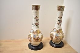 Two presumed Meiji-period Japanese Satsuma ware mantle vases, featuring traditional figural