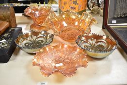 A selection of 20th-century Fenton-style carnival glass bowls, to include a Northwood Marigold